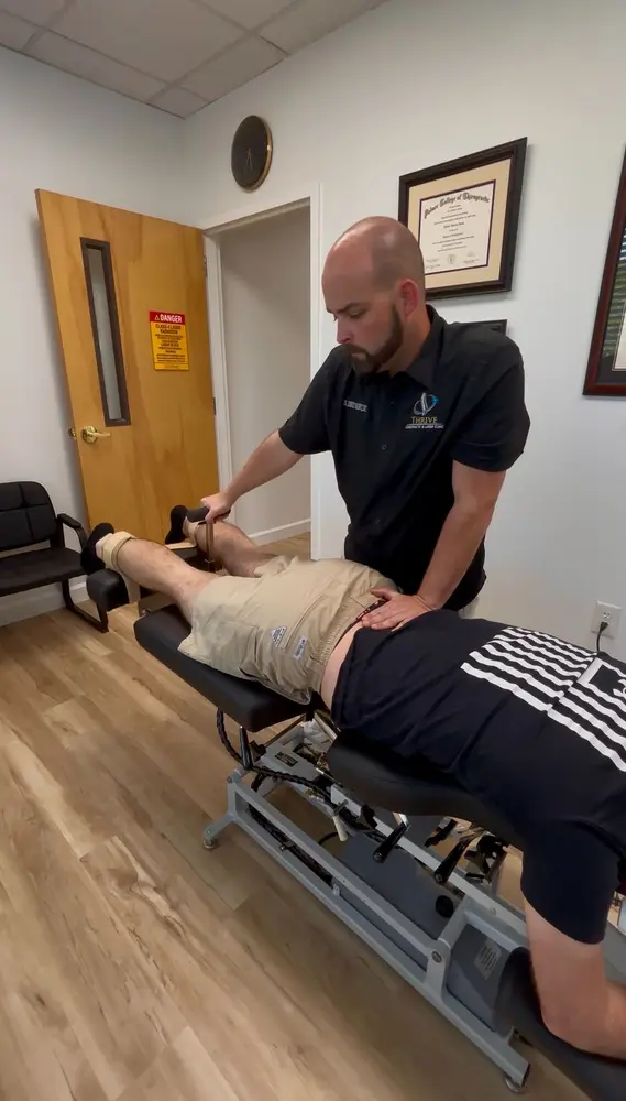 Manual flexion and distraction spinal decompression in progress