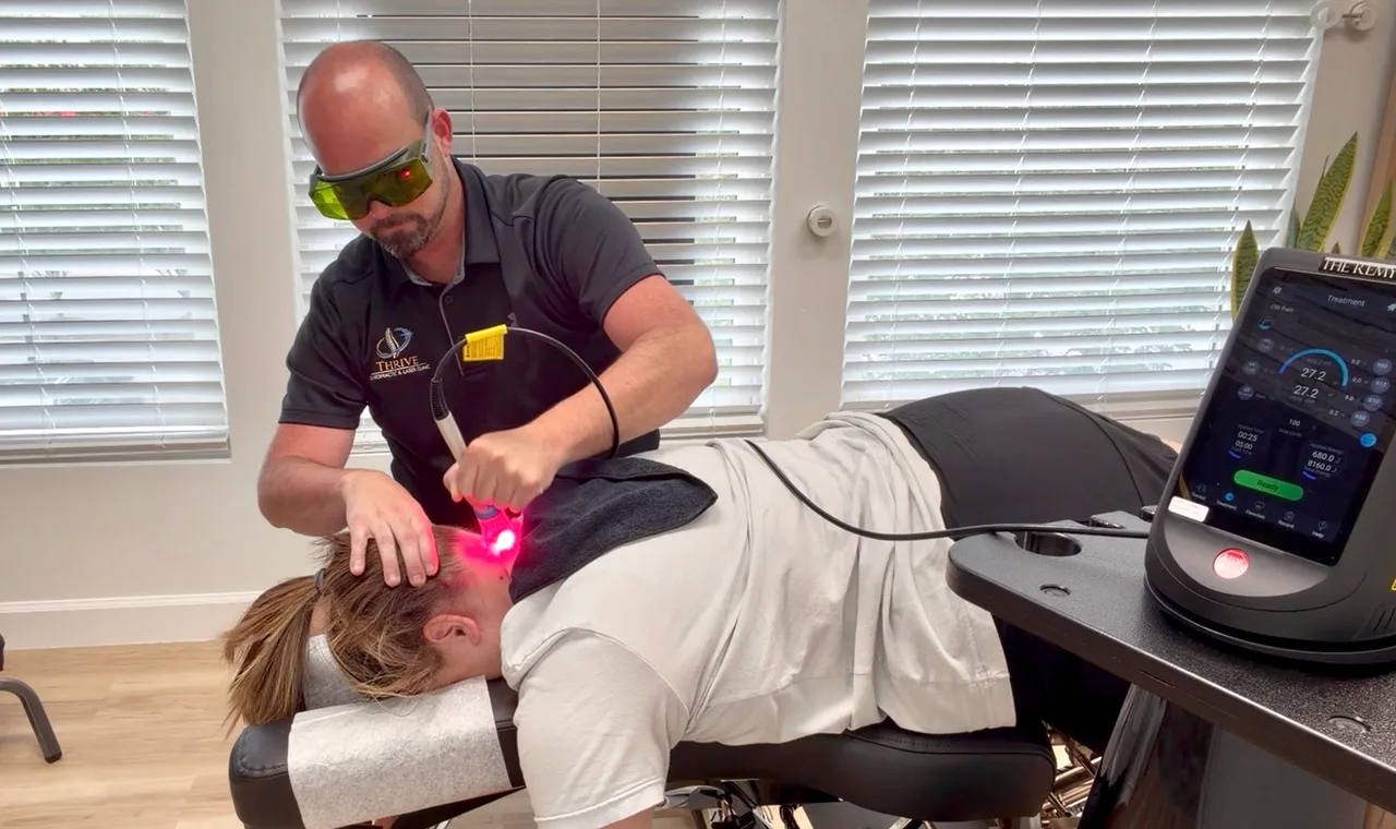 Dr. Hunt delivering Class IV Laser Therapy to a patient in the clinic
