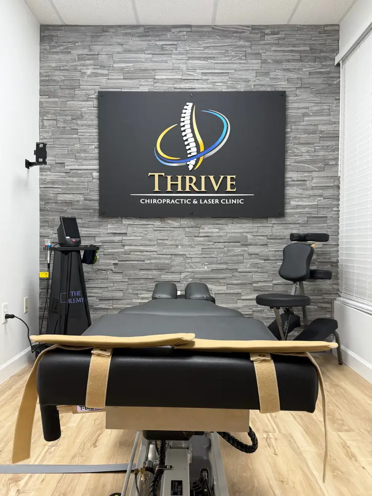 Adjustment room with stone feature wall and Thrive logo