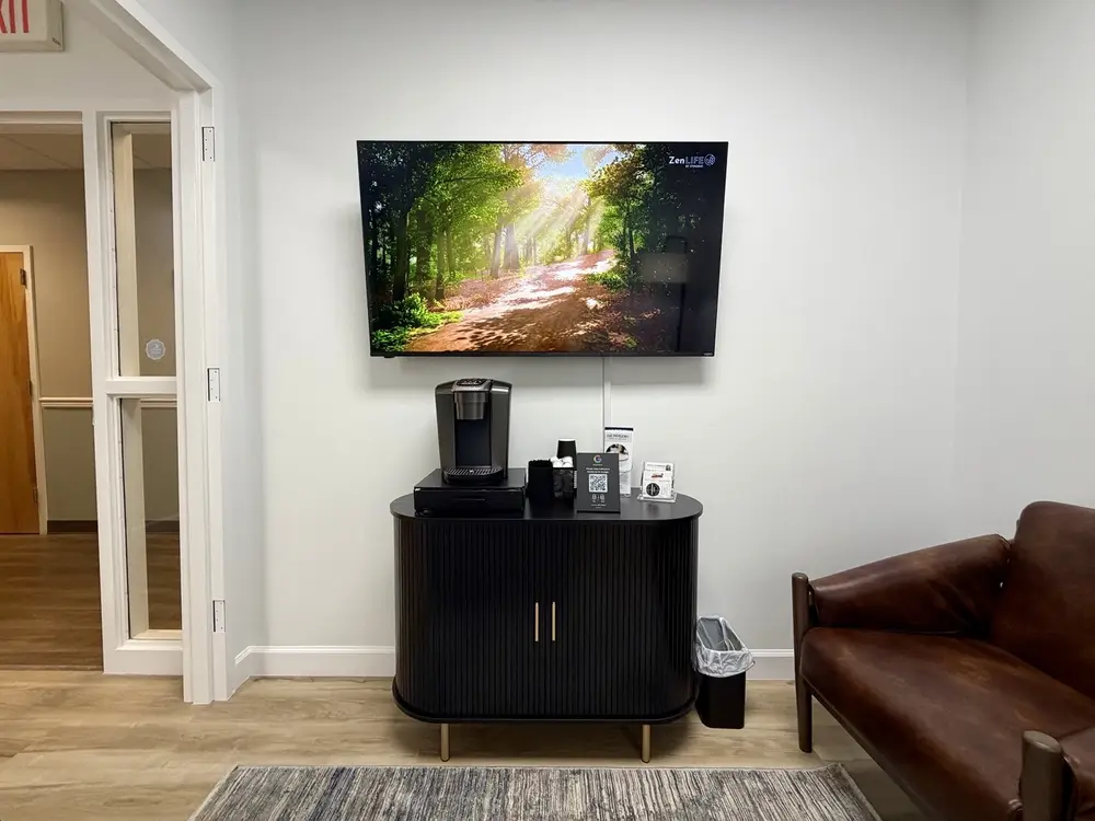Patient lounge with complimentary coffee and comfortable seating